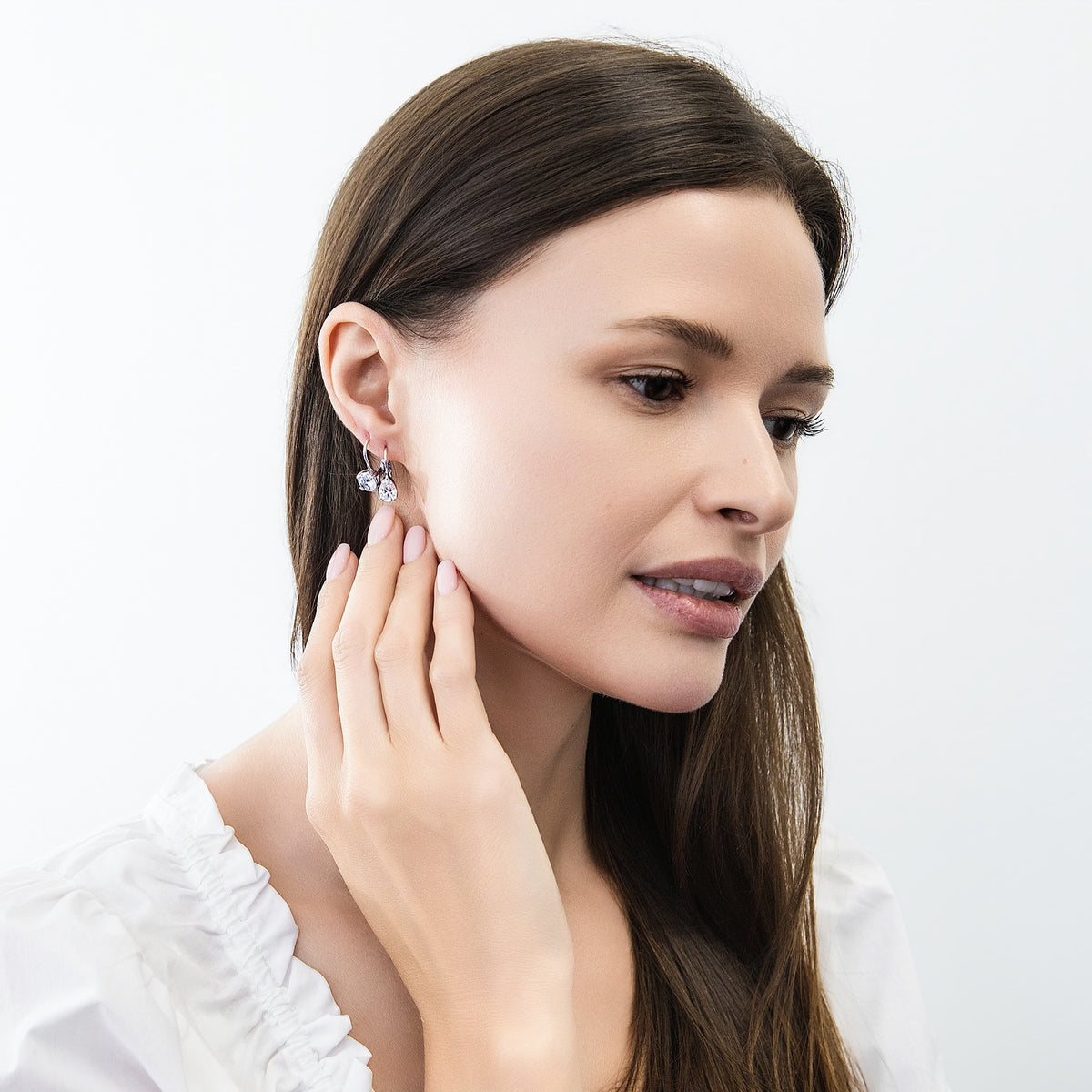 Model wearing Solitaire 1.6-2.6ct Pear CZ Leverback Earrings in Sterling Silver, Clear