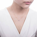 Model wearing Solitaire 0.45ct Bezel CZ Necklace in Sterling Silver, Rose Gold Flashed