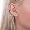 Model wearing Solitaire Asscher CZ Stud Earrings in Sterling Silver, 4mm