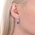 Model wearing Halo Art Deco Marquise CZ Earrings in Sterling Silver, Sapphire Color