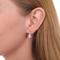 Model wearing Solitaire Pear CZ Leverback Earrings in Sterling Silver, Clear