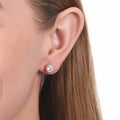 Model wearing Solitaire Cartilage CZ Cartilage Stud Earrings in Sterling Silver, Rose Gold Flashed