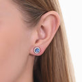 Model wearing Halo CZ Stud Earrings in Sterling Silver, Blue Color