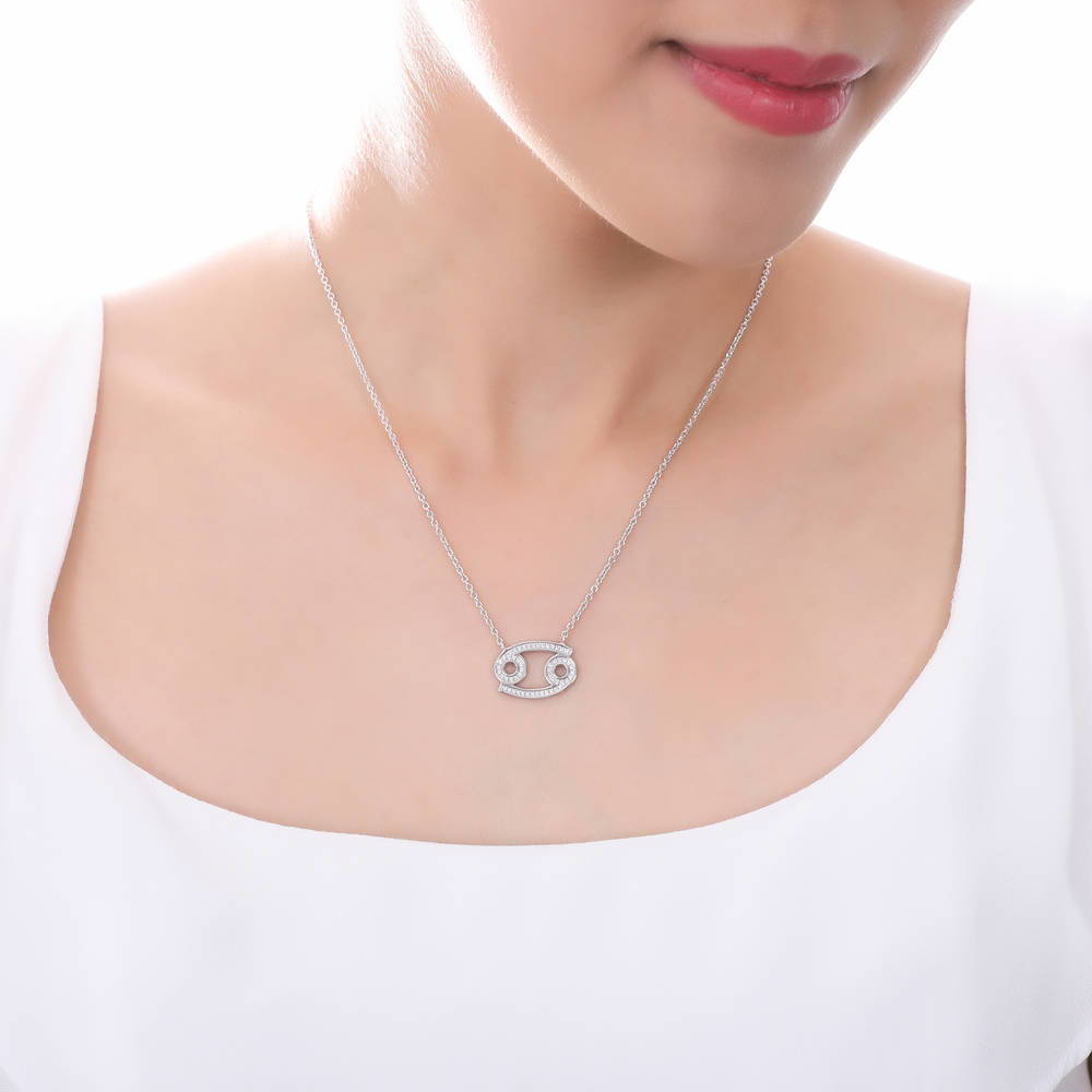Model wearing Zodiac CZ Pendant Necklace in Sterling Silver, Aquarius