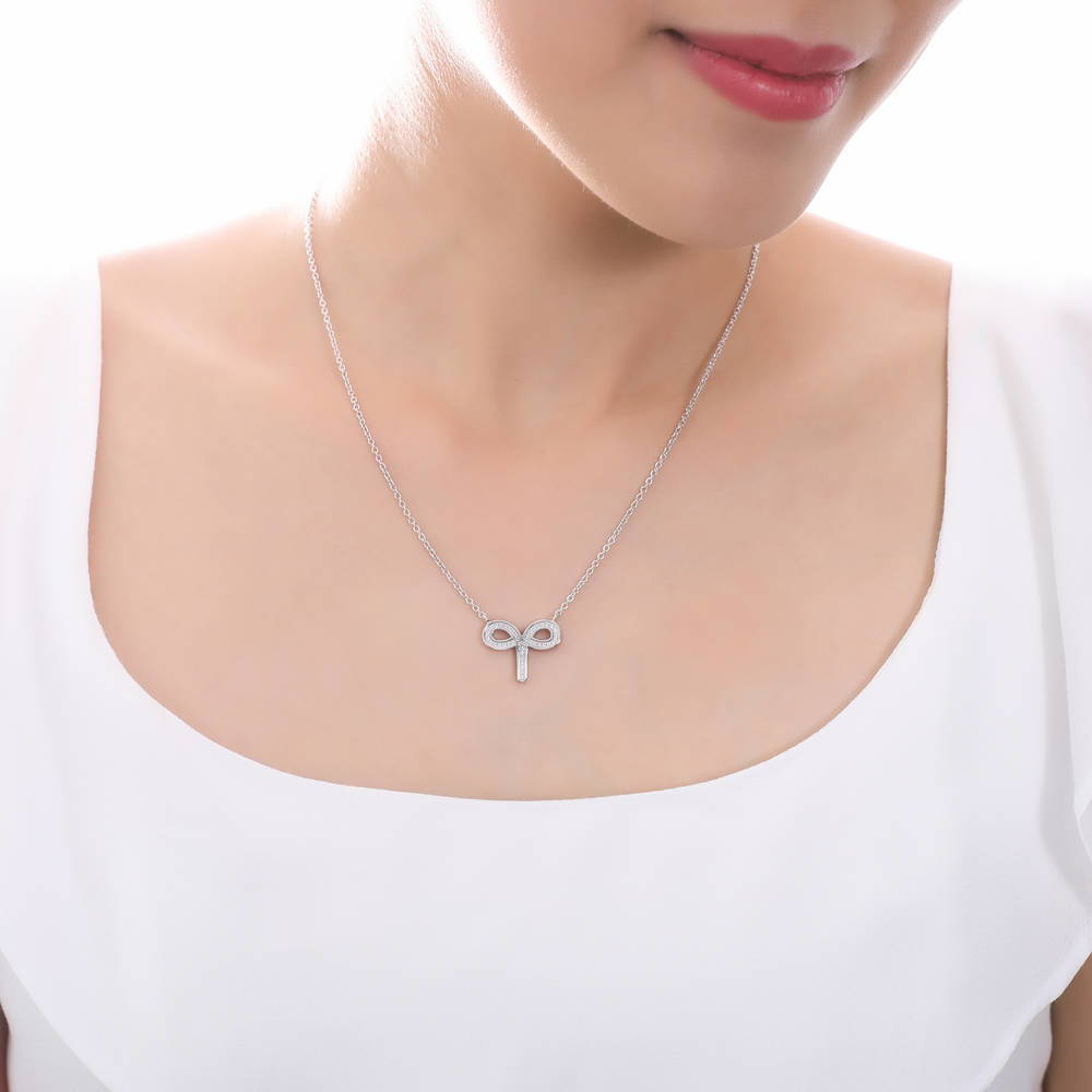 Model wearing Zodiac Sign CZ Necklace in Sterling Silver, Aries