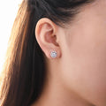 Model wearing Halo CZ Stud Earrings in Sterling Silver, Sapphire Color