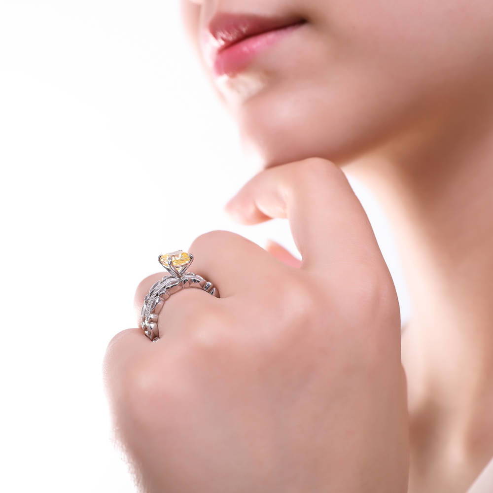 Model wearing Solitaire 3ct Canary Yellow Cushion CZ Ring in Sterling Silver, 18 of 18