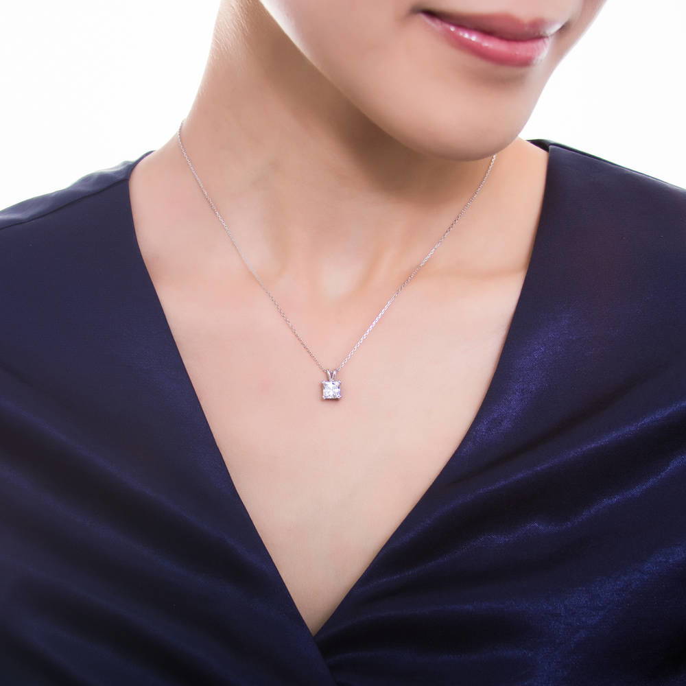 Model wearing Solitaire CZ Necklace in Sterling Silver, Princess Cut / Clear
