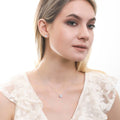 Model wearing Solitaire 1.6ct CZ Stud Earrings in Sterling Silver, Rhodium Plated / Greyish Blue