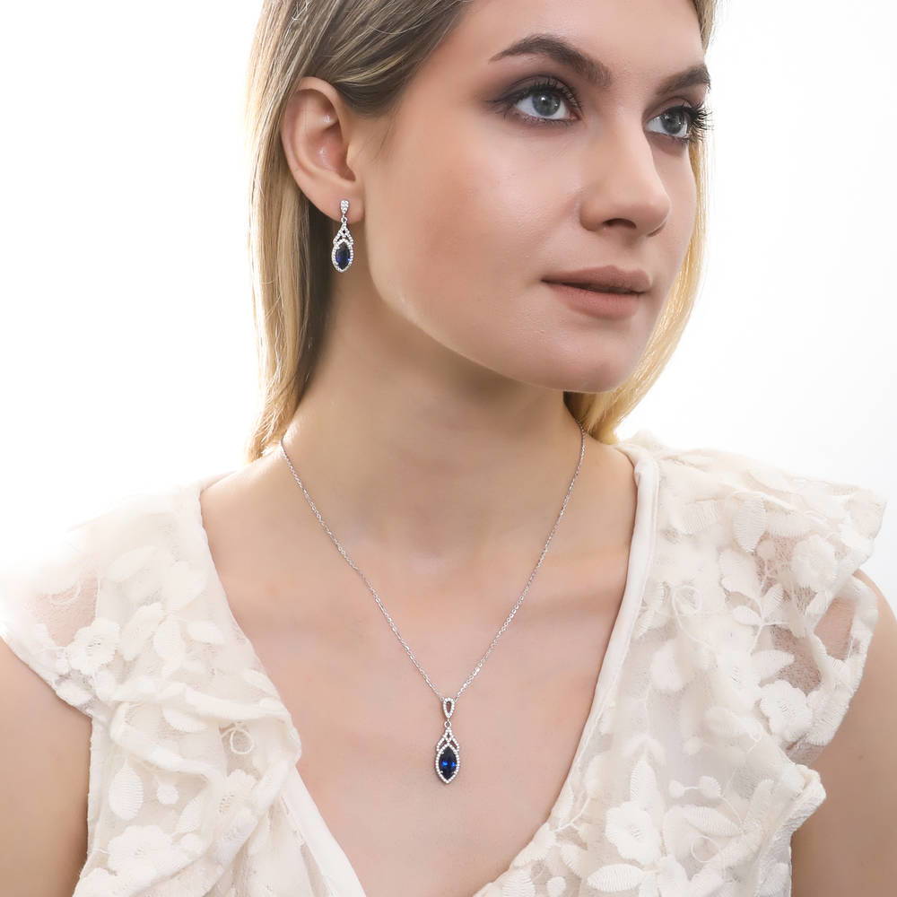 Model wearing Halo Art Deco Sapphire-Blue CZ Necklace in Sterling Silver, 3 of 5