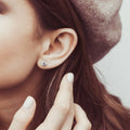Model wearing Solitaire 1.6ct CZ Cartilage Stud Earrings in Sterling Silver