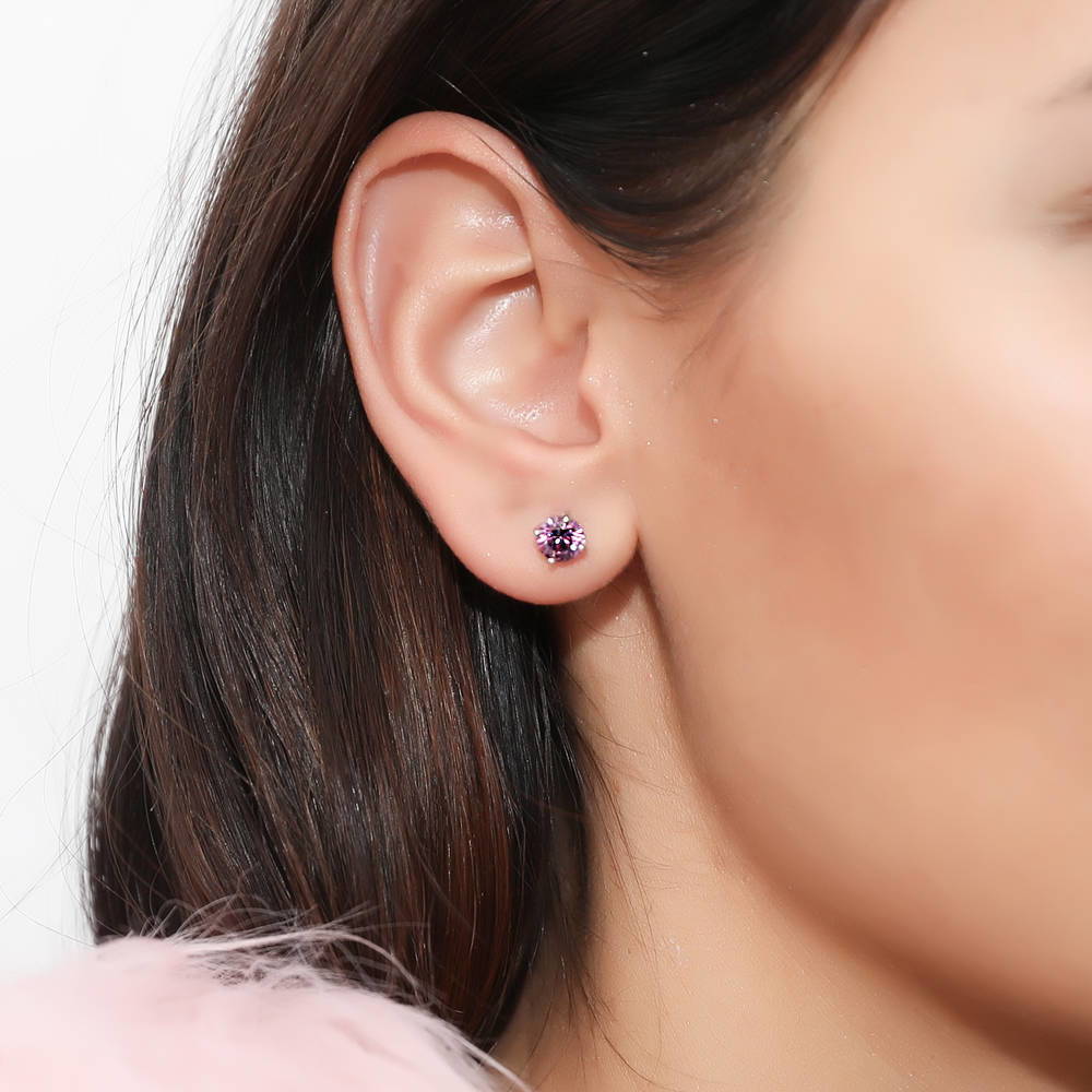 Model wearing Solitaire 1.6ct CZ Cartilage Stud Earrings in Sterling Silver, Purple