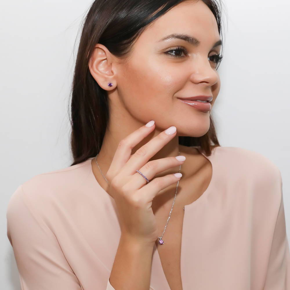 Model wearing Solitaire 1.6ct CZ Cartilage Stud Earrings in Sterling Silver, Purple