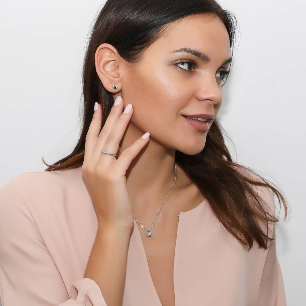 Model wearing Solitaire 1.6ct CZ Cartilage Stud Earrings in Sterling Silver, Green