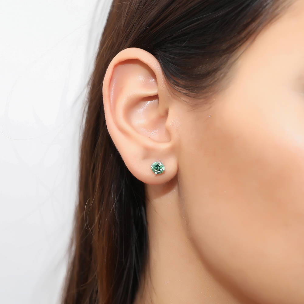 Model wearing Solitaire 1.6ct CZ Stud Earrings in Sterling Silver, Rhodium Plated / Green