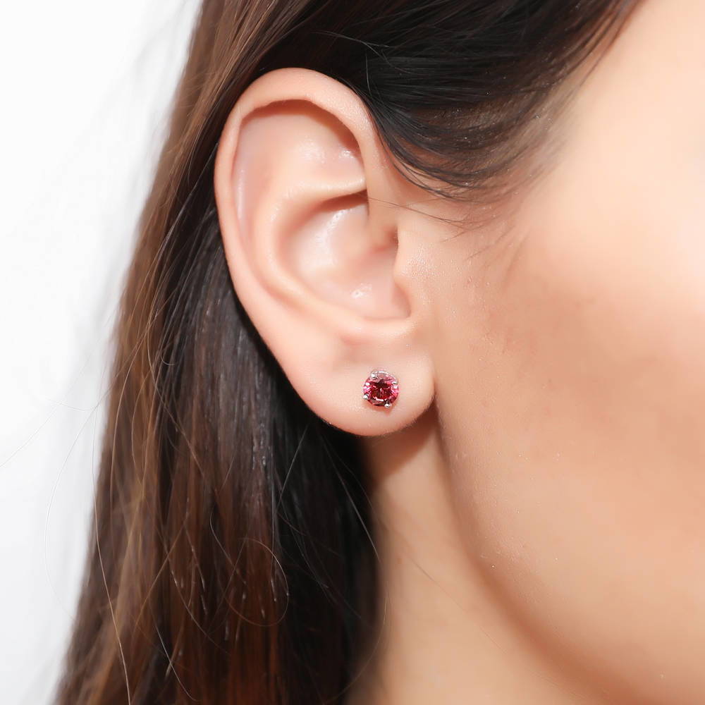 Model wearing Solitaire 1.6ct CZ Cartilage Stud Earrings in Sterling Silver, Red