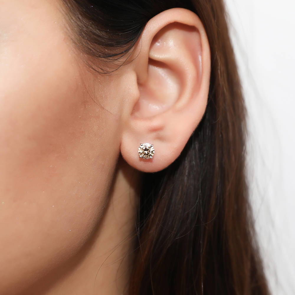 Model wearing Solitaire 1.6ct CZ Stud Earrings in Sterling Silver, Rhodium Plated / Yellow