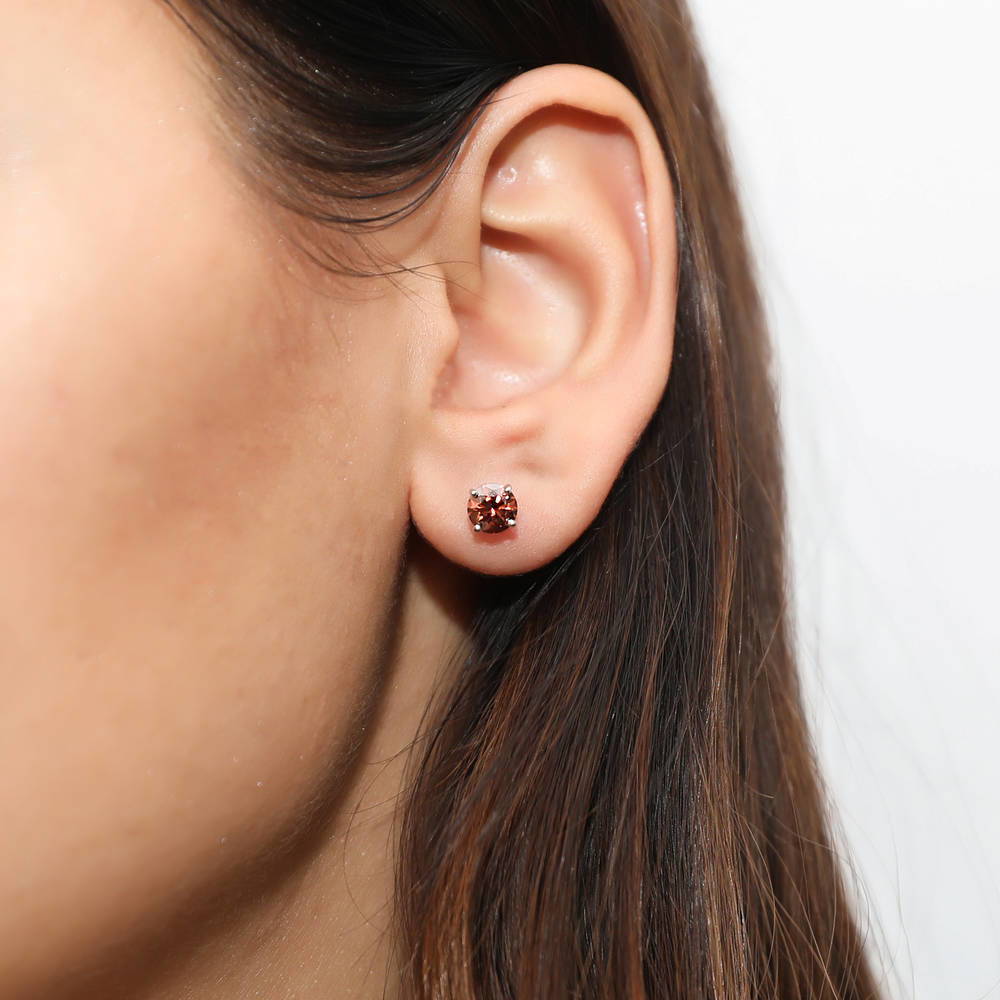 Model wearing Solitaire 1.6ct CZ Stud Earrings in Sterling Silver, Rhodium Plated / Caramel