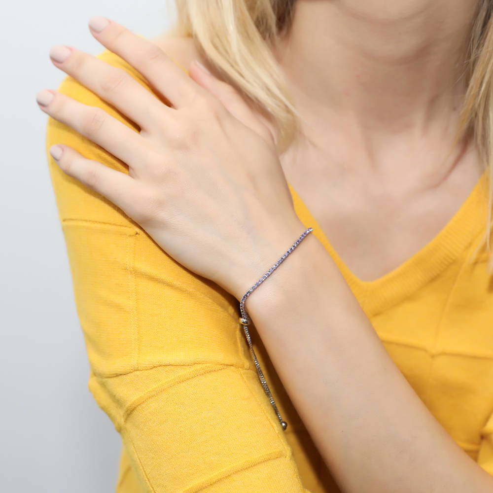 Model wearing CZ Tennis Bracelet Gold Flashed, Purple Color