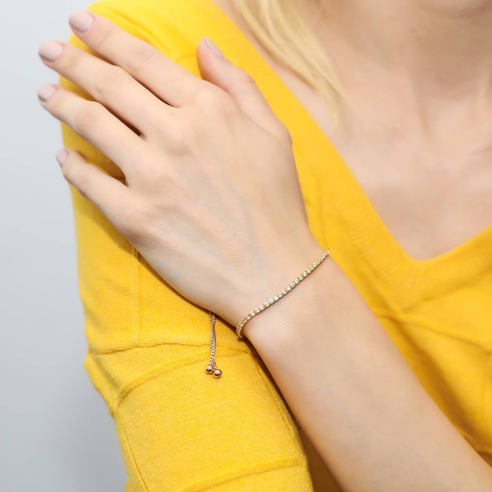 Model wearing CZ Tennis Bracelet Gold Flashed, Yellow Color