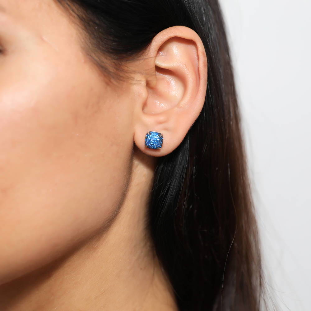 Model wearing Square CZ Stud Earrings in Sterling Silver, Blue Color