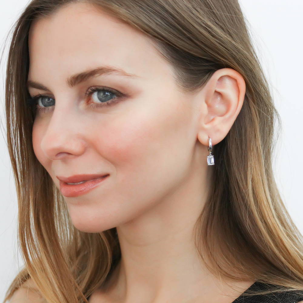 Model wearing Solitaire CZ Huggie Earrings in Sterling Silver 0.5 inch, 17 of 19