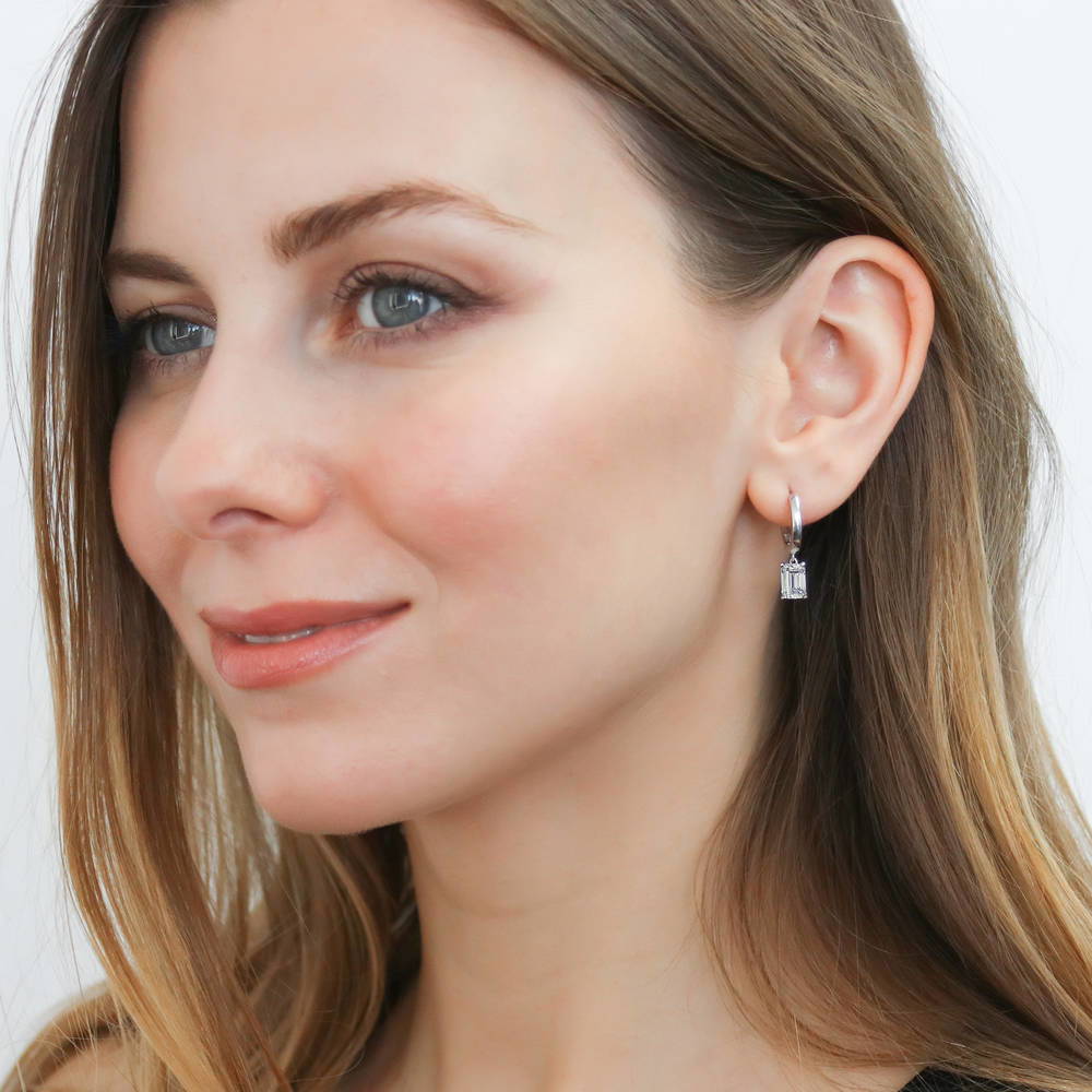 Model wearing Solitaire CZ Huggie Earrings in Sterling Silver 0.5 inch, 16 of 19