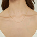 Model wearing Bar CZ Pendant Necklace in Sterling Silver, Yellow Gold Flashed