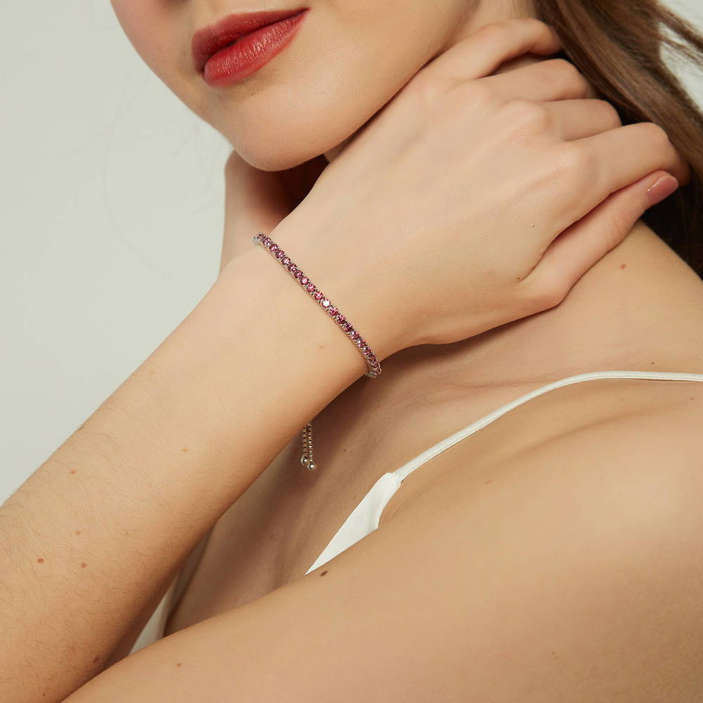 Model wearing CZ Tennis Bracelet in Sterling Silver 4-9 inch, Red Color