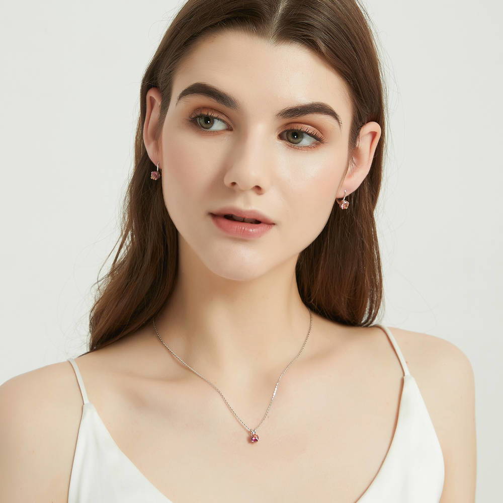 Model wearing Kaleidoscope Solitaire CZ Necklace in Sterling Silver 0.8ct, Red Orange Color