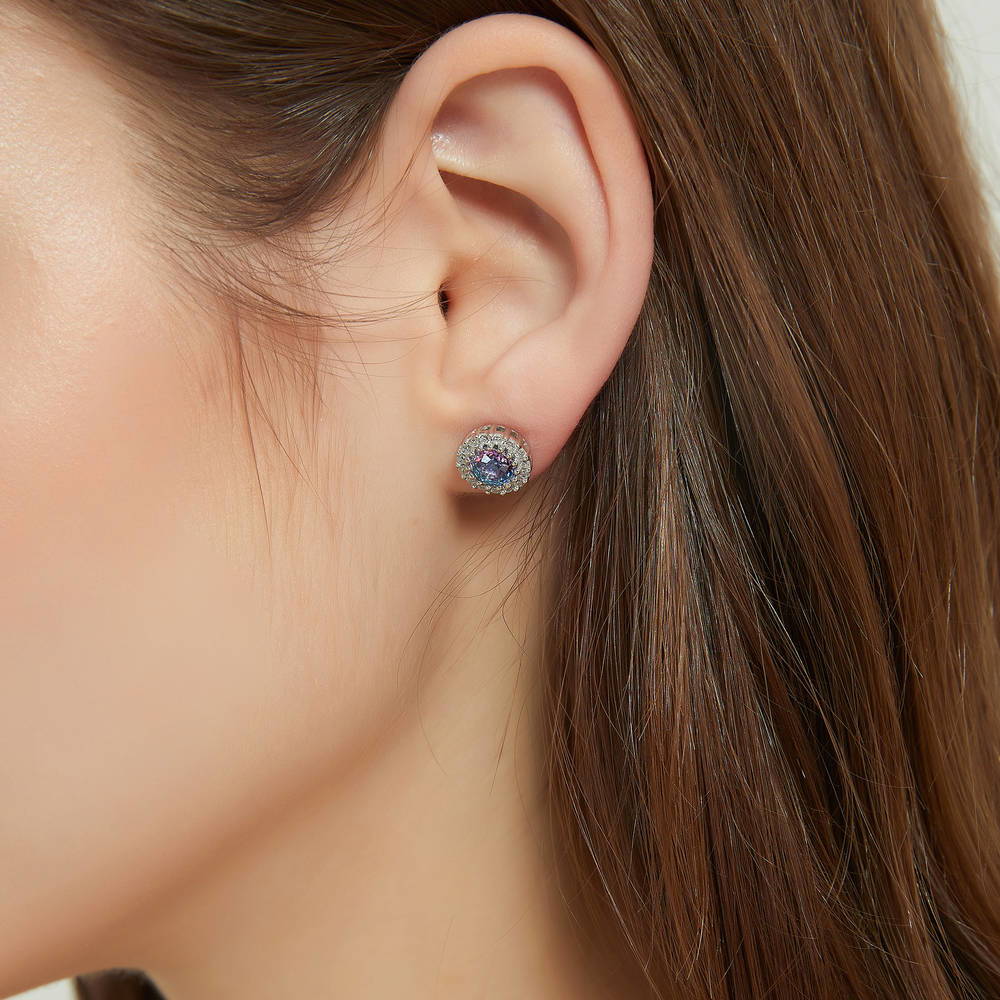 Model wearing Halo Kaleidoscope CZ Stud Earrings in Sterling Silver, Purple Aqua Color