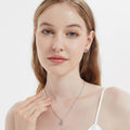 Model wearing Halo Kaleidoscope CZ Stud Earrings in Sterling Silver, Purple Color