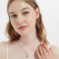 Model wearing Halo Kaleidoscope CZ Stud Earrings in Sterling Silver, Caramel Color