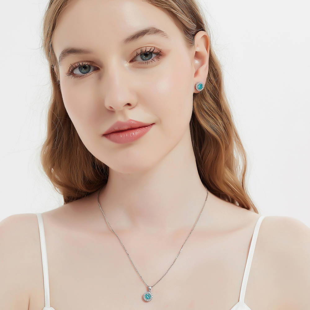 Model wearing Halo Kaleidoscope CZ Stud Earrings in Sterling Silver, Frosty Mint Color