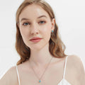 Model wearing Halo Kaleidoscope CZ Stud Earrings in Sterling Silver, Frosty Mint Color