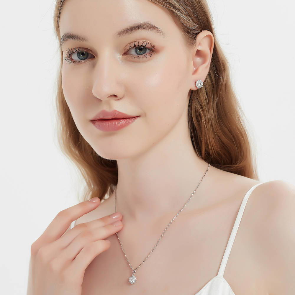 Model wearing Flower Halo CZ Stud Earrings in Sterling Silver, 6 of 9