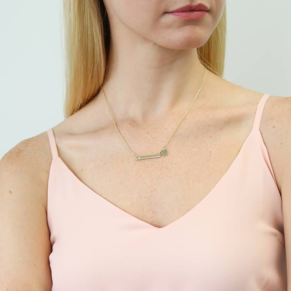 Model wearing Bar Heart CZ Necklace in Sterling Silver, Yellow Gold Flashed