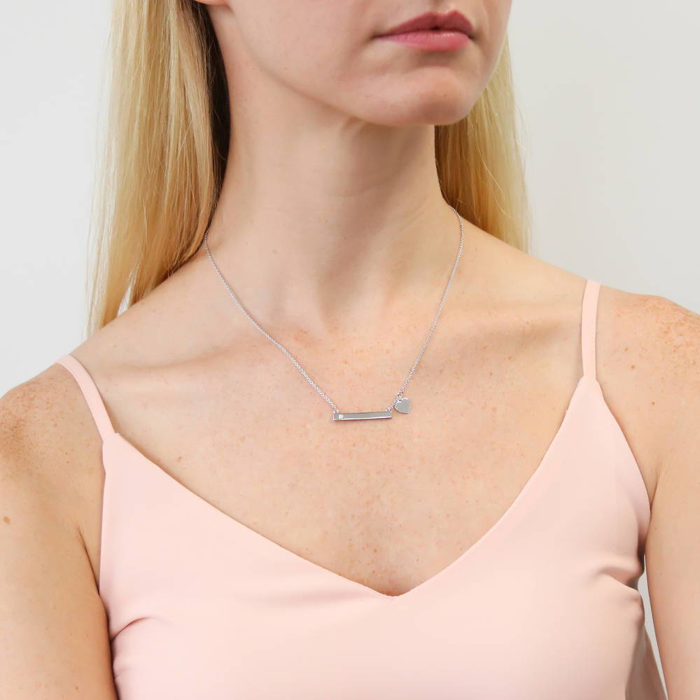 Model wearing Bar Heart CZ Necklace in Sterling Silver, Yellow Gold Flashed