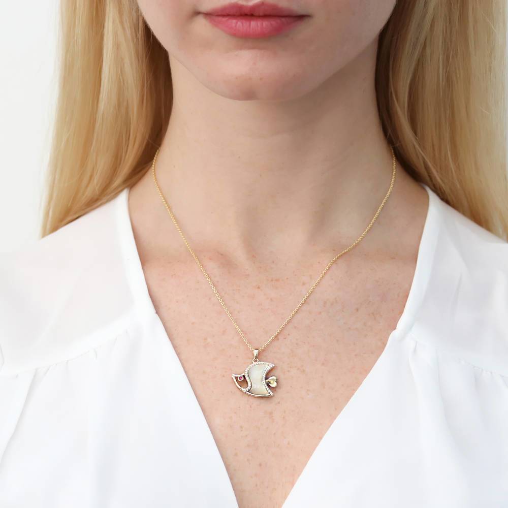 Model wearing Fish Mother Of Pearl Necklace in Sterling Silver, Yellow Gold Flashed