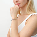 Model wearing Bar CZ Tennis Bracelet in Sterling Silver 6-10 inch, Rhodium Plated