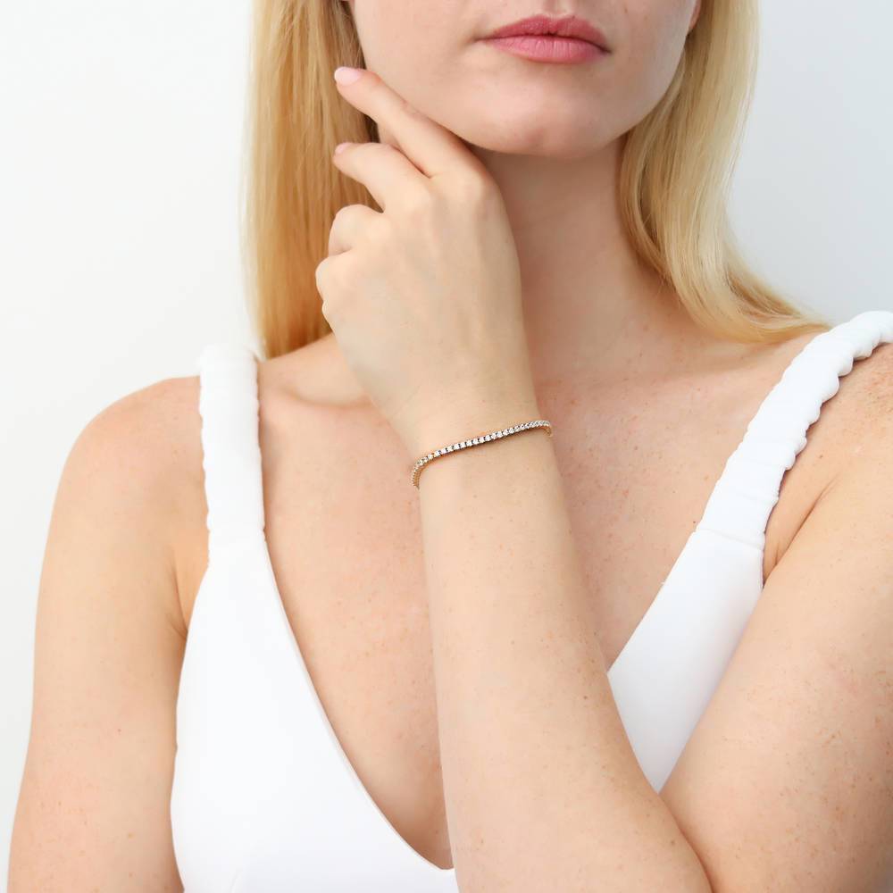 Model wearing Bar CZ Tennis Bracelet in Sterling Silver 6-10 inch, Yellow Gold Flashed