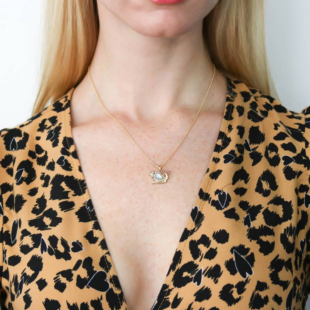 Model wearing Snail Mother Of Pearl Necklace in Sterling Silver, Yellow Gold Flashed