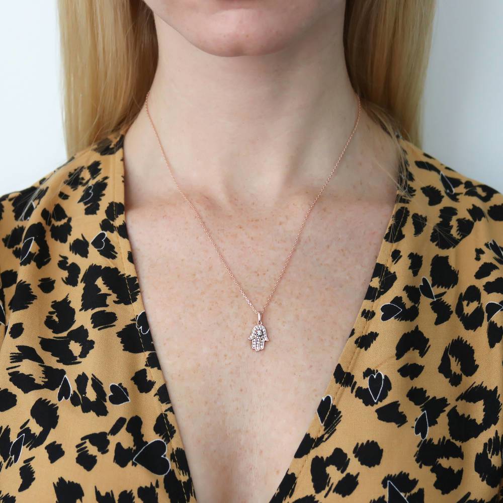 Model wearing Hamsa Hand CZ Necklace in Sterling Silver, Rose Gold Flashed