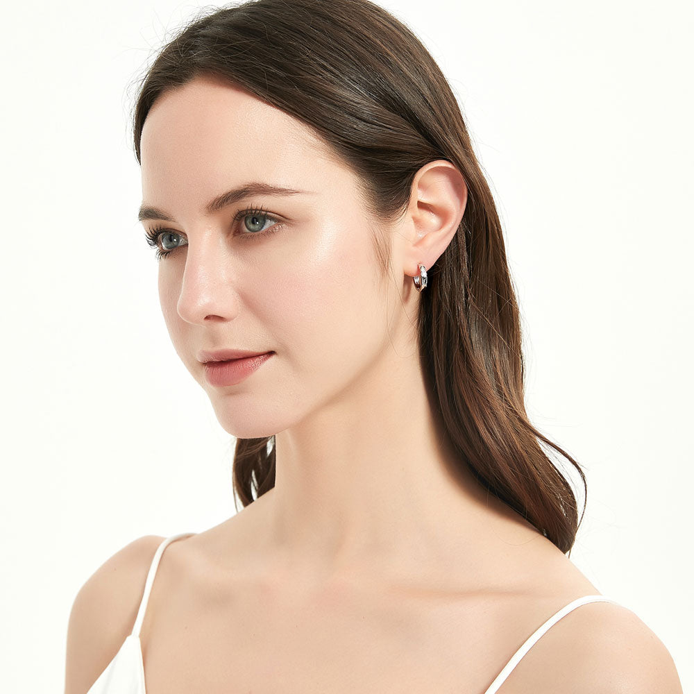 Model wearing Solitaire CZ Small Hoop Earrings in Sterling Silver 0.6 inch, Rhodium Plated