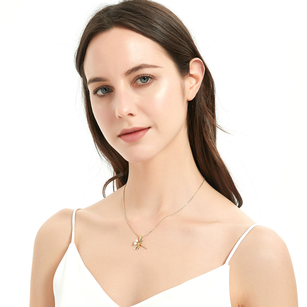 Model wearing Dragonfly Button Cultured Pearl Necklace in Sterling Silver, Yellow Gold Flashed