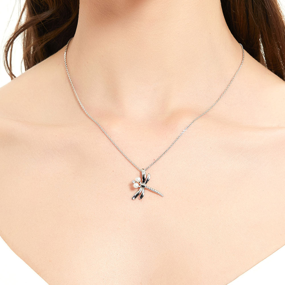 Model wearing Dragonfly Button Cultured Pearl Necklace in Sterling Silver, Yellow Gold Flashed