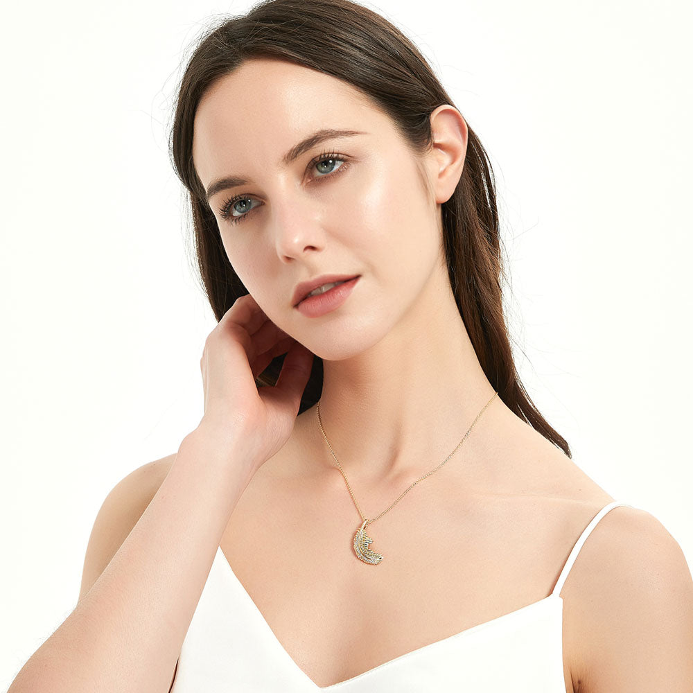 Model wearing Feather CZ Necklace and Earrings in Sterling Silver, Yellow Gold Flashed