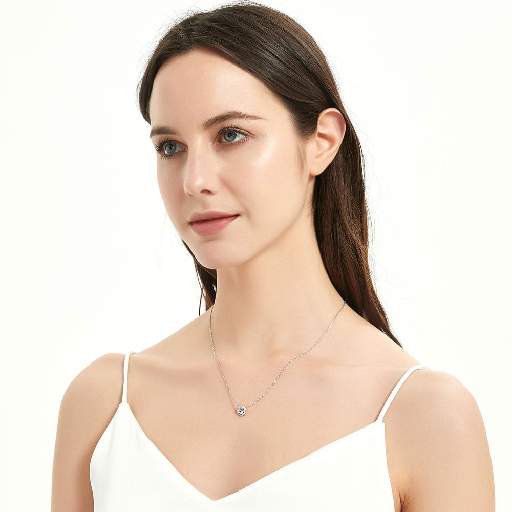 Model wearing Halo CZ Pendant Necklace in Sterling Silver, 8 of 11