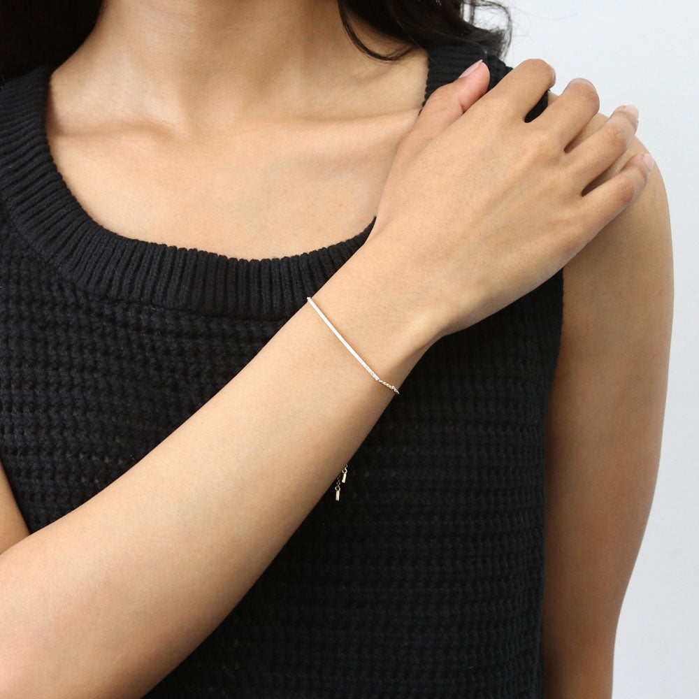 Model wearing Bar CZ Rolo Chain Bracelet in Sterling Silver, Yellow Gold Flashed