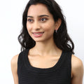 Model wearing Woven Small Hoop Earrings in Sterling Silver 0.7 inch, Yellow Gold Flashed